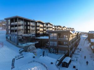 an aerial view of a building in the snow at Riddergaarden Hotel & Mountain Lodge, Beitostølen in Beitostøl