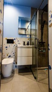 a bathroom with a toilet and a sink at FLH - Citadel Garden Central Free Parking in Alba Iulia +51 photos