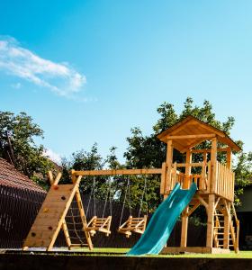 a wooden playground with a slide and a gazebo at FLH - Citadel Garden Central Free Parking in Alba Iulia