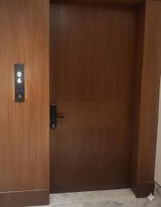 an open door with a smiley face on it at شقة مريحة بأثاث جديد وعمارة جديدة قرب المطار in Riyadh +1 photo