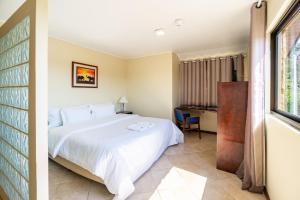 Postel nebo postele na pokoji v ubytování Suíça Iguaçu Hotel & Resort