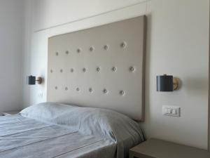 Postel nebo postele na pokoji v ubytování Dormi e Vai