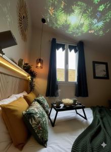 Postel nebo postele na pokoji v ubytování Évasion Tropicale Dépaysement chic - Gare SNCF + 19 fotografií