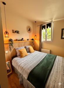 Postel nebo postele na pokoji v ubytování Évasion Tropicale Dépaysement chic - Gare SNCF