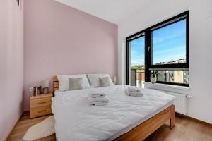 Ένα ή περισσότερα κρεβάτια σε δωμάτιο στο Metropolitan Star Apart Hotel