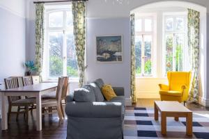 a living room with a couch and a table and chairs at GuestReady - Tranquil Apartment in Dublin in Dublin
