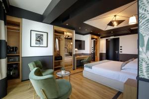 a hotel room with a bed and a chair at The Fourth Dimension by Domidea in Rome