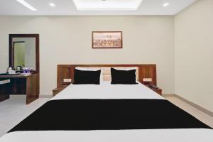Ένα ή περισσότερα κρεβάτια σε δωμάτιο στο Super Hotel O Le Grande Hotel & Banquet +26 φωτογραφίες