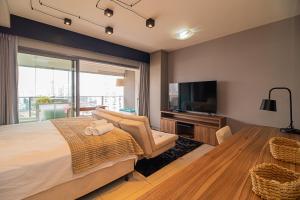 Кровать или кровати в номере Nude Stay- Famoso Habitarte Brooklin- P - 4 pessoas