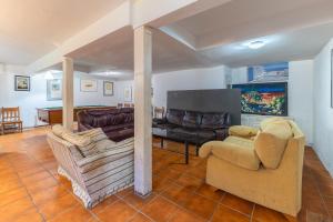 a living room with two chairs and a couch at Villa Pilara - Brunete in Brunete