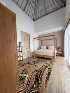 a bedroom with a bed and a large rug at Artoria Dream Villas Bali in Nusa Dua +102 photos