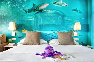 a bedroom with a bed with a shark wall at Mirador Maspalomas by Dunas in Maspalomas +31 photos