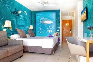 a bedroom with an aquarium themed room with a bed at Mirador Maspalomas by Dunas in Maspalomas