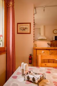 a kitchen with a table with a plate on it at Apartment La Tibolire in Sixt +31 photos