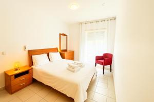 Postel nebo postele na pokoji v ubytování Oceanos 12 Holiday Apartment, Portimão, Algarve