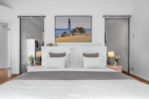 Ένα ή περισσότερα κρεβάτια σε δωμάτιο στο Ferienwohnung Strandperle Lutterbek