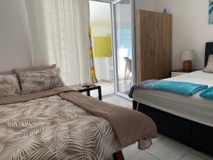 Postel nebo postele na pokoji v ubytování Apartments and Rooms Radivojević Niš + 19 fotografií