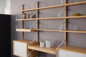 a room with wooden shelves with cups on them at Donizetti Studios in Bergamo +28 photos