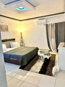 Residence succes house tesisinde bir odada yatak veya yataklar