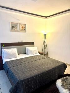 Residence succes house tesisinde bir odada yatak veya yataklar