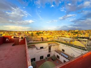 a view of a city from the roof of a building at vintage in Fez