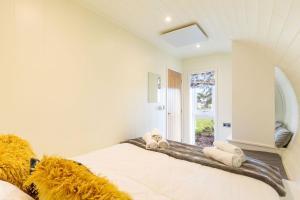 a bedroom with a bed with towels on it at South Black Hill in Penicuik