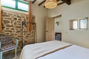 Postel nebo postele na pokoji v ubytování Casa Oliva by gaiarooms
