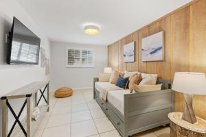 a bedroom with a bed and a tv at Summer Nights in Bailey Hall