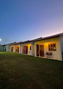 a house with a lawn in front of it at Casa de Temporada Estrela de Alter in Santarém