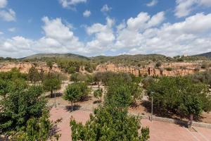 a view of a canyon with trees and rocks at La Cantonada in Sant Pere de Ribes