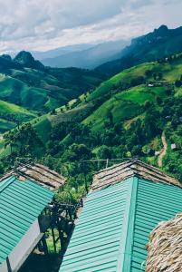 a view of the hills from a house at Homestay Nunga หนูหง่าโฮมสเตย์กิกอคอ in Pang Mapha