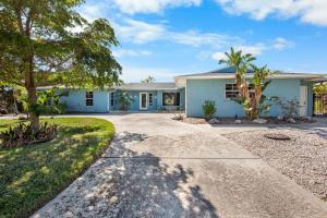 a house with a driveway in front of it at Siesta Dreamin' in Siesta Key