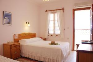 a bedroom with two beds and a teddy bear sitting on the bed at Toloman Hotel Bitez Beach in Bitez +67 photos