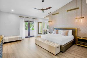 a bedroom with a bed and a couch in it at Casa Blanca in Siesta Key +52 photos