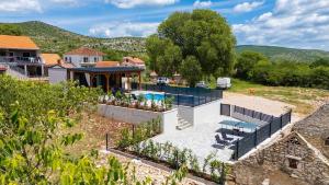 an aerial view of a house with a swimming pool at KAPO Mobile Home in Sitno Donje