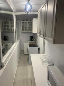 Η κουζίνα ή μικρή κουζίνα στο Bia's apartament
