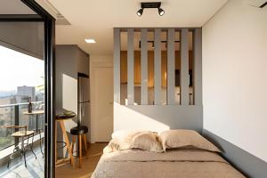 Postel nebo postele na pokoji v ubytování Alto & Estilo | Batel