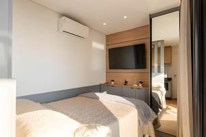 Postel nebo postele na pokoji v ubytování Alto & Estilo | Batel