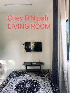 TV a/nebo společenská místnost v ubytování Ctiey D'Nipah + 4 fotografie