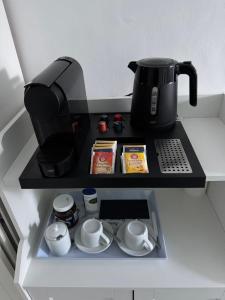 a coffee maker on a shelf in a kitchen at Fam. Honnef in Hannover