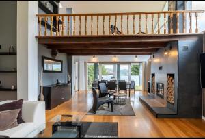 a living room with a white couch and a fireplace at Villa Romeo in Oviedo
