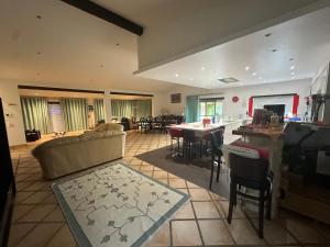 a large living room with a couch and a table at Casal do Aviador in São Vicente do Paul