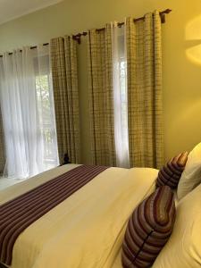 Postel nebo postele na pokoji v ubytování D&Y Homes