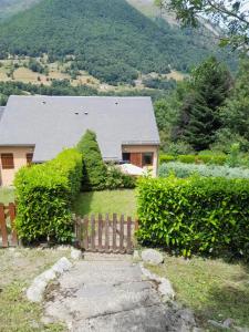 a house with ivy growing on the side of it at Cauterets in Cauterets +12 photos