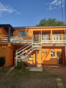 a building with a staircase in front of it at CERCA DEL MAR - Costa Azul in Costa Azul