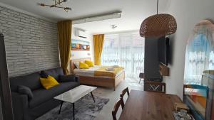 Et opholdsområde på Vivid Sea and City Luxury Studio 2 plus 2