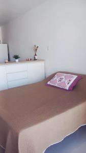 a bedroom with a bed with a blanket on it at Ojo Turco Monoambiente Temporario in Santiago del Estero +20 photos