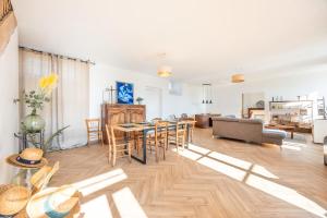 a living room with a table and a couch at Gite Du Val D'egray in Champdeniers-Saint-Denis