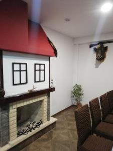 a living room with a dog house on the wall at семеен хотел Обзор in Progled