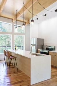 a kitchen with a white counter and a sink at The Briar House in Stella +23 photos